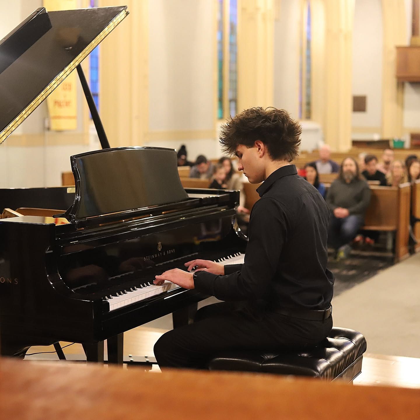 Teen pianist performing on a Steinway grand piano at a Piano Place Ottawa recital