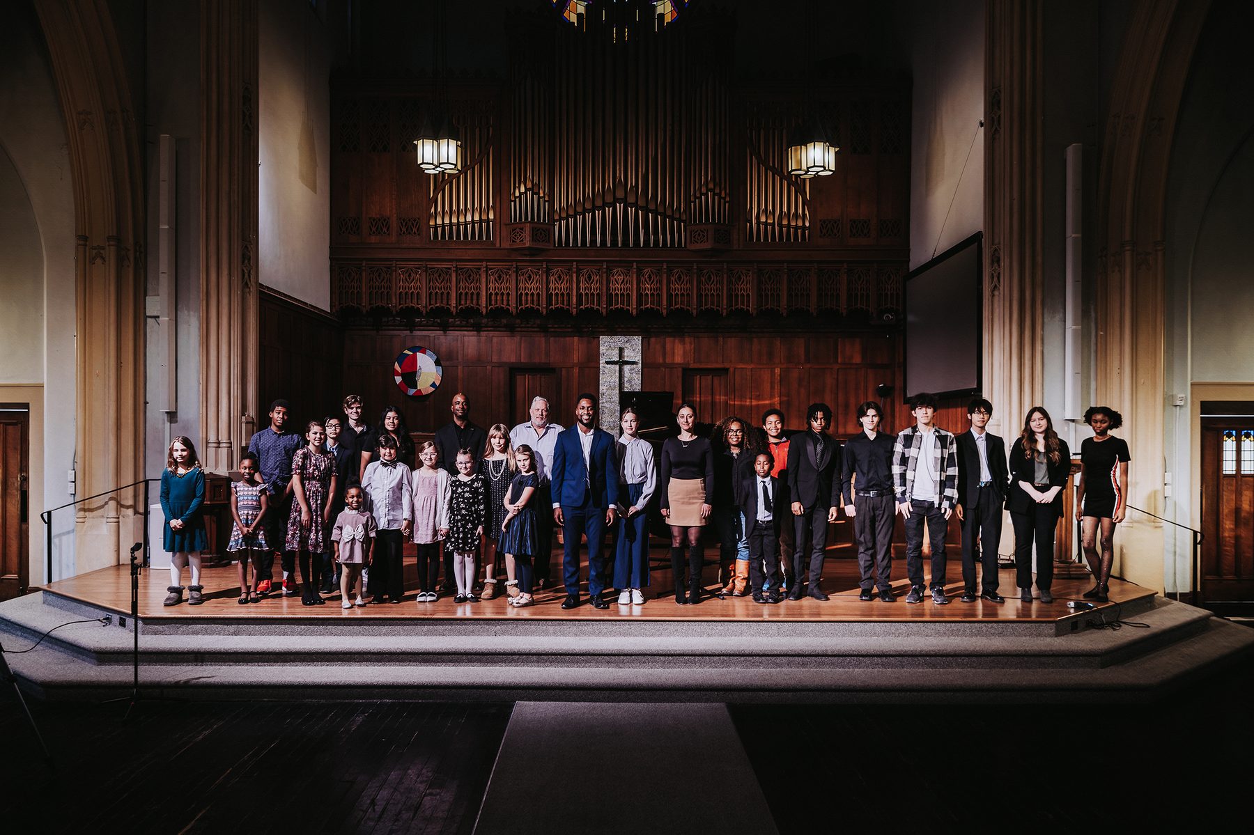 Students and teachers of The Piano Place Ottawa on stage after a recital